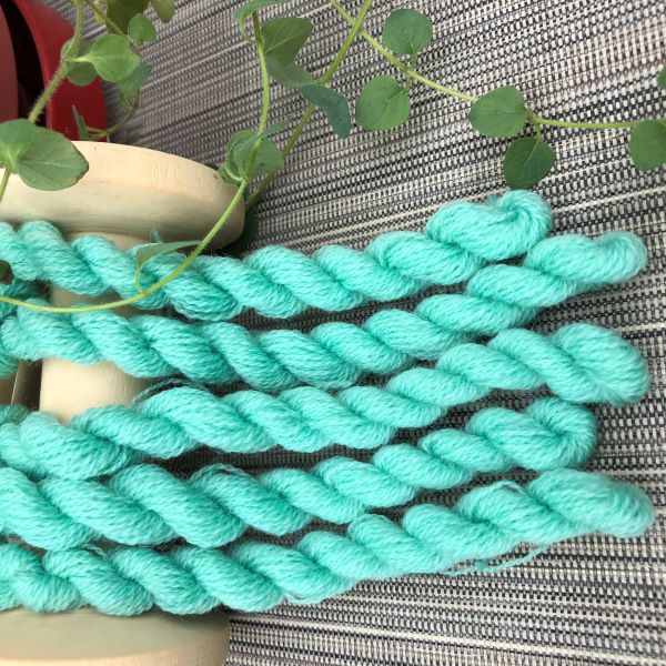 Skeins of hand dyed wool thread in Seafoam Green