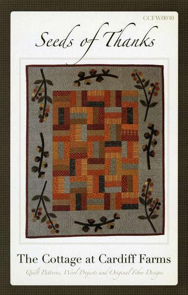 Table topper or wall hanging with cotton pieced rail fence blocks in the center and wool applique border of  bittersweet vines. 