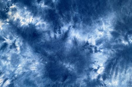 Hand dyed cotton flannel fabric with dark, medium, lt blue and white mottling.