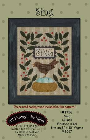 Sing wool applique on cotton wall hanging with a robins nest with eggs, a robbin and greenery on both sides with the word 