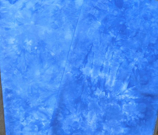Hand dyed, medium blue, cotton flannel with mottling from light to dark for wool and cotton applque backgrounds and backings.