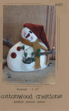 Wool Snowman has a flat bottom so he sits nicely, a long wool scarf, twigs for arms, a red stocking cap, buttons and a cute face.  