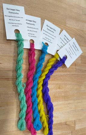 Sampler of hand dyed wool threads in spring colors of green, pink, blue, yellow and purple.  Great for wool applique, crewel work and any hand embroidery.