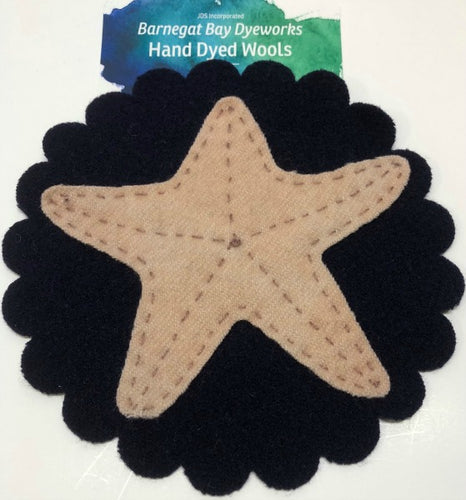 Pre cut tan woolstarfish on a navy scalloped mat.