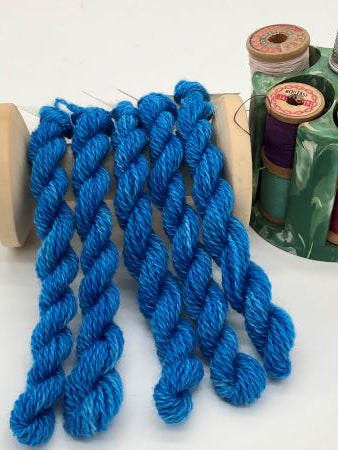 Five skeins of hand dyed #8 wool thread is a bright happy variegated blue the color of brilliant summer skies - perfect for wool applique, crewel work or any embroidery.