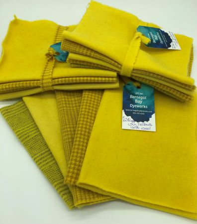 Five hand dyed wool pieces in a bright happy yellow for wool applique.