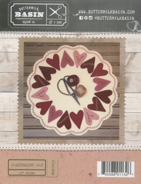 Sweetheart wool applique red and pink hearts on a cream background with beautiful stitching to highlight the hearts.