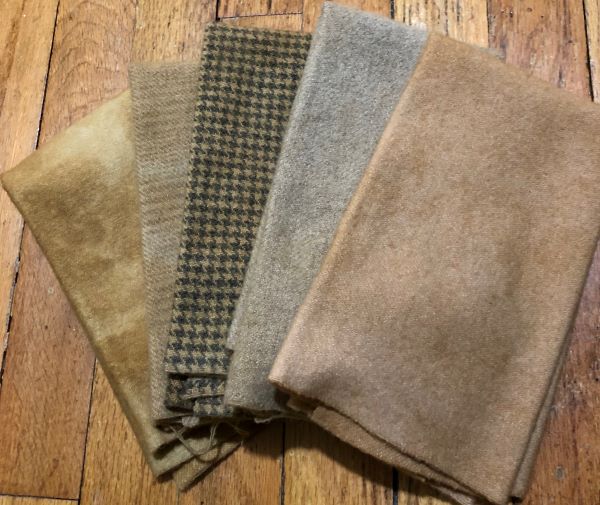 Five hand dyed, 100% wool pieces in various textures and shades of tan