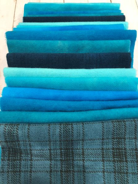 Hand dyed wool bundles in blue teals