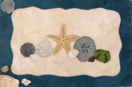 Wool applique wall hanging Tideline with shells, a starfish , sea urchin and a sand dollar.  A Barnegat Bay Dyeworks orginal.
