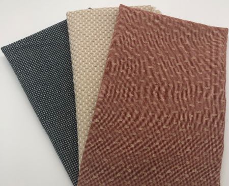 Cotton fabric bundle in red, blue and tan for cotton and wool applique backgrounds or quilt piecing.