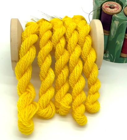 This hand dyed #8 wool thread is a bright medium yellow perfect for wool applique and crewel work.